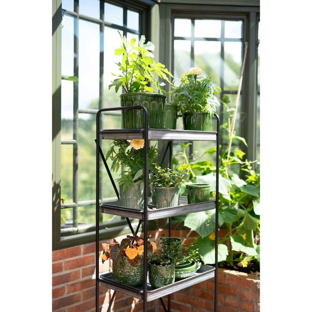 PENNY Hylde med hjul med krukker og planter på